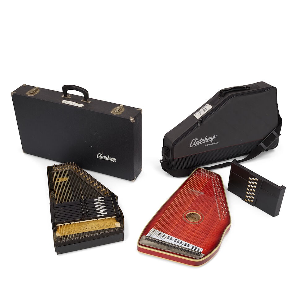 TWO OSCAR SCHMIDT AUTOHARPS: TWO OSCAR SCHMIDT AUTOHARPS Comprising a limited-edition red maple model OS-110-21 example, serial no. 961056, with a fitted soft case and an ebonized wood example, serial no. 5819, in a fitted