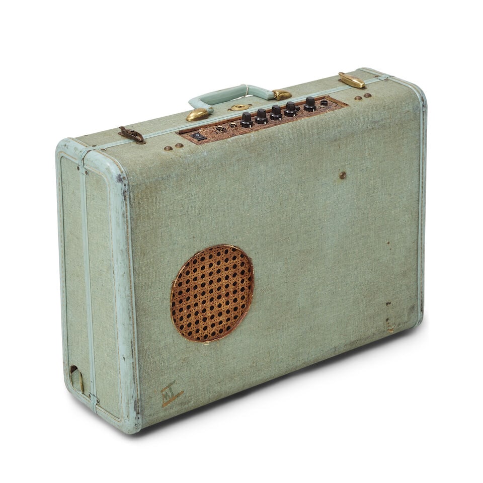 A TOUR-USED CUSTOM SOUTHERN FOLKLORE MEMPHIS BLUES BOX SUITCASE AMPLIFIER Handmade by Matt Isbell: A TOUR-USED CUSTOM SOUTHERN FOLKLORE MEMPHIS BLUES BOX SUITCASE AMPLIFIER Handmade by Matt Isbell 16 x 21 x 6in This lot is subject to the following lot symbols: ¤ ¤ Unless indicated by the