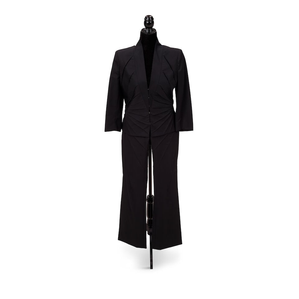 TWO ALEXANDER MCQUEEN BLACK SUITS AND AN EVENING JACKET Alexander McQueen, 'Scanners' Collection...: TWO ALEXANDER MCQUEEN BLACK SUITS AND AN EVENING JACKET Alexander McQueen, 'Scanners' Collection, Fall/Winter 2003 Comprising a black wool zipper trim skirt suit, a black wool counter pleated pant sui
