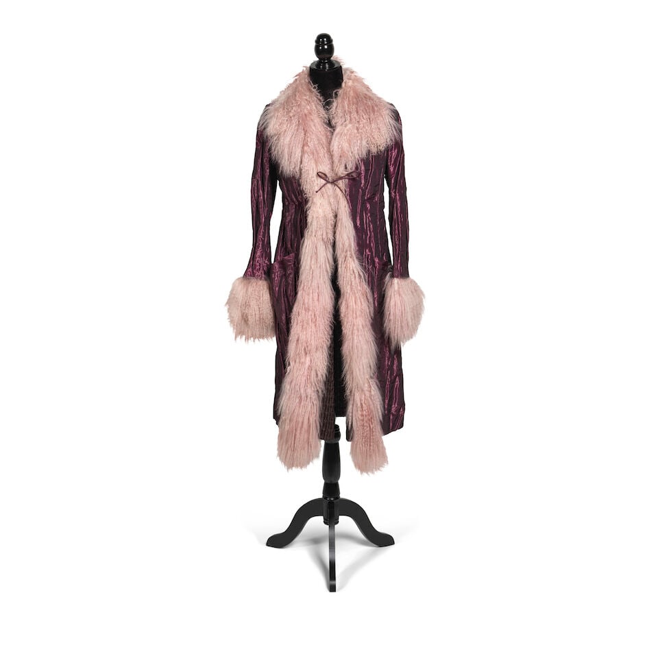 A NICOLE MILLER PURPLE FAUX LINED COAT WORN TO THE GRAMMY'S 2003: A NICOLE MILLER PURPLE FAUX LINED COAT WORN TO THE GRAMMY'S 2003 length 43in Footnotes: Worn to the 45th Annual Grammy Awards at Madison Square Garden, New York City, New York, 23 February