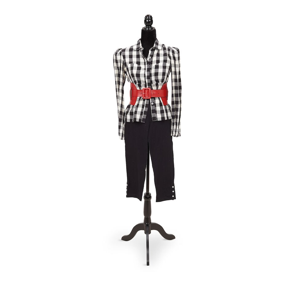 A GROUP OF BLACK AND WHITE CLOTHING FROM PUBLIC APPEARANCES 2001-2010: A GROUP OF BLACK AND WHITE CLOTHING FROM PUBLIC APPEARANCES 2001-2010 Comprising a Nicole Miller geometric patterned button-up blouse, a Dead Idol thick striped button-up blouse, a Diesel Style Lab