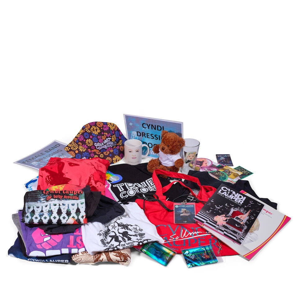 A GROUP OF BEHIND-THE-SCENES TOUR MEMORABILIA AND MERCHANDISE 2000s and later: A GROUP OF BEHIND-THE-SCENES TOUR MEMORABILIA AND MERCHANDISE 2000s and later Including backstage passes, VIP stickers, buttons, tickets, two tote bags, a bucket hat, nineteen tank tops and t-shirts, 