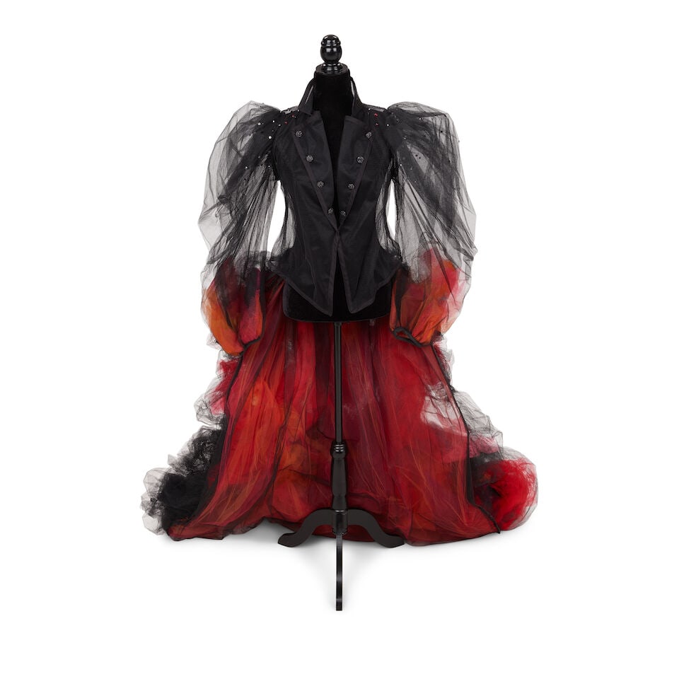 A TULLE SHRUG JACKET AND TRAIN WITH BUSTLE Made for the She's So Unusual: 30th Anniversary Tour,...: A TULLE SHRUG JACKET AND TRAIN WITH BUSTLE Made for the She's So Unusual: 30th Anniversary Tour, 2013 The jacket embellished with sequins and with orange and pink tulle at the sleeves, the train with