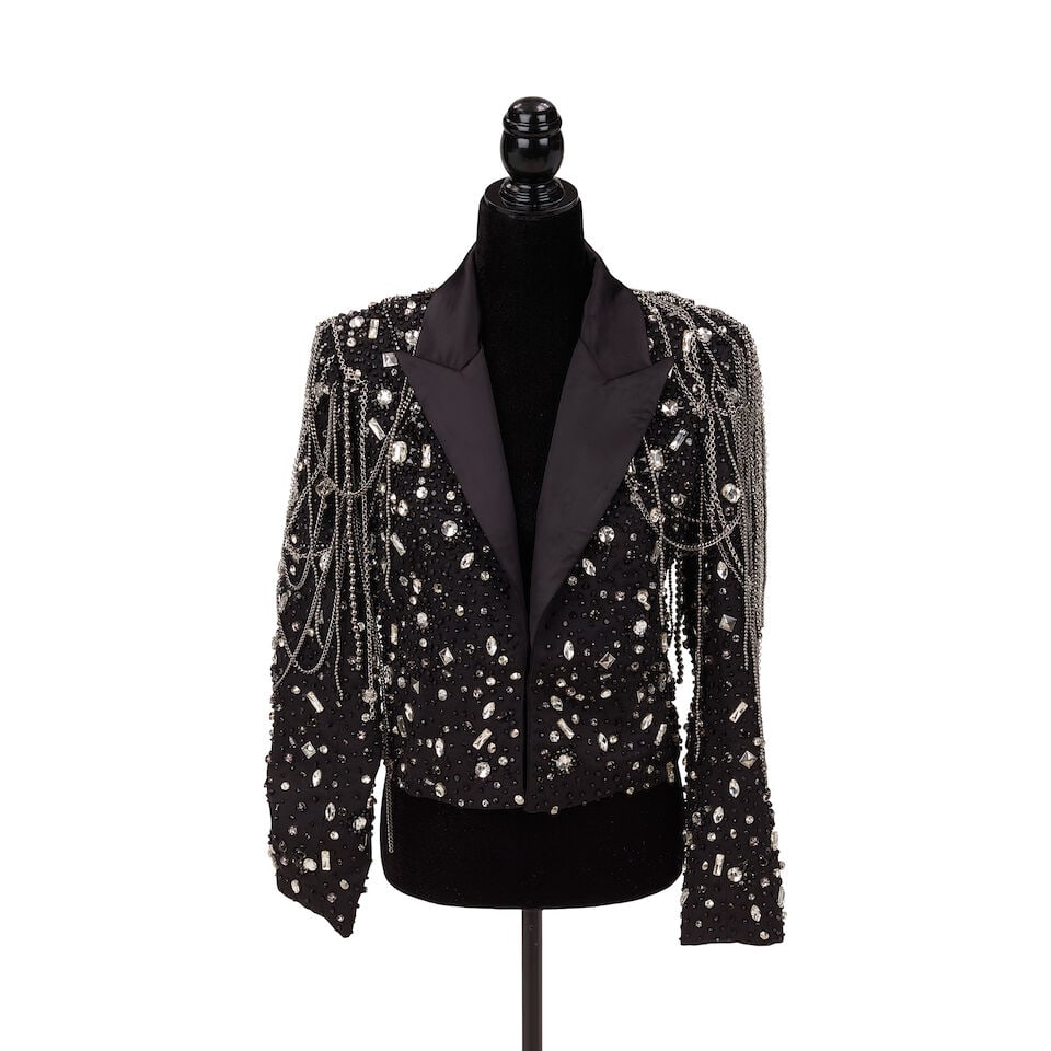 A L'AGENCE EMBELLISHED BLACK 'SOMA' BLAZER WORN AT THE ROCK & ROLL HALL OF FAME RED CARPET 2025: A L'AGENCE EMBELLISHED BLACK 'SOMA' BLAZER WORN AT THE ROCK & ROLL HALL OF FAME RED CARPET 2025 The satin trimmed crop blazer hand-embellished with colorless rhinestones, black beads, and silver-tone