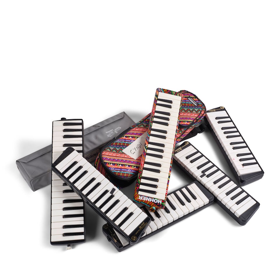 SIX HOHNER MELODICAS AND A HOHNER AIRBOARD: SIX HOHNER MELODICAS AND A HOHNER AIRBOARD Comprising four Piano 26 examples, one Piano 32 example, and one piano 36 example, all in cases, and an Airboard with a piece of tape on the case inscribed