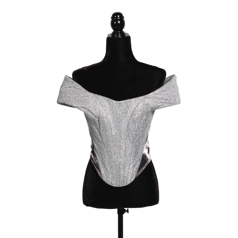 A GROUP OF LOOKS FROM THE GIRLS JUST WANNA HAVE FUN FAREWELL TOUR 2024-2025: A GROUP OF LOOKS FROM THE GIRLS JUST WANNA HAVE FUN FAREWELL TOUR 2024-2025 Comprising two similar Geoffrey Mac silver metallic looks comprising an off-the-shoulder corset top, a pair of zippered pant