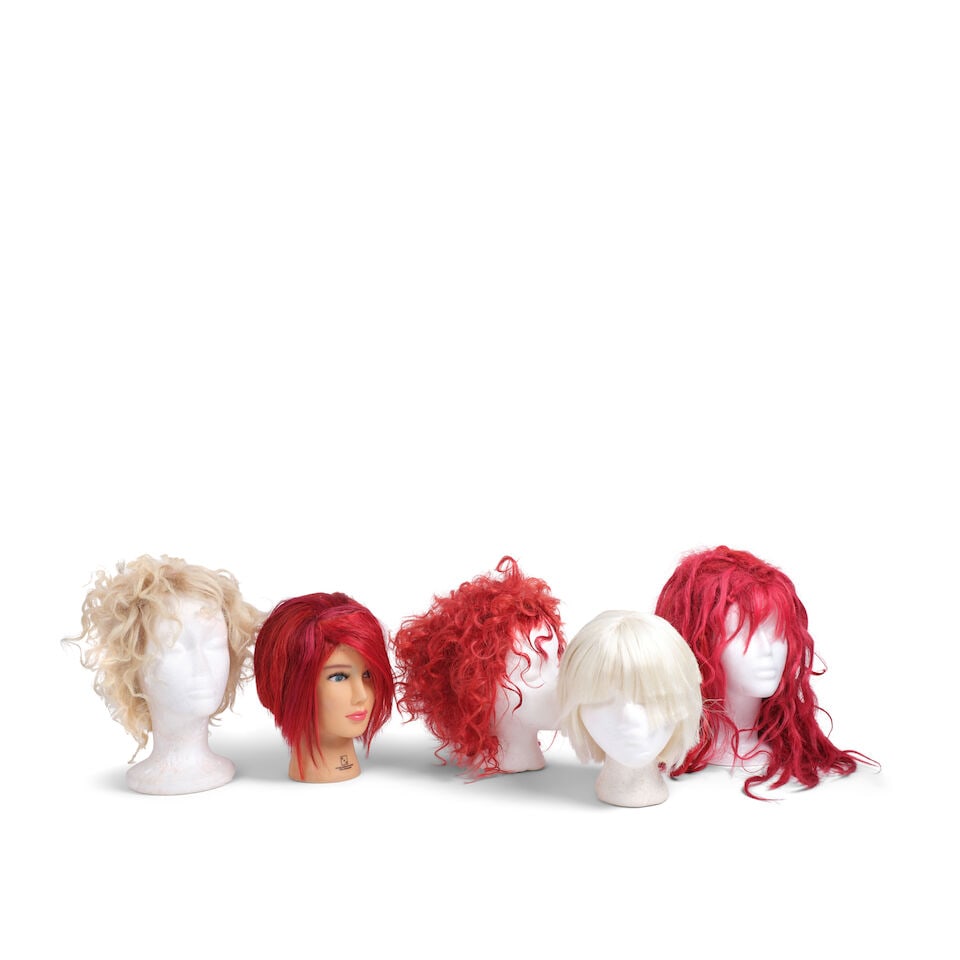 TEN PROMOTIONAL EVENT AND STAGE-WORN WIGS 2008-2024: TEN PROMOTIONAL EVENT AND STAGE-WORN WIGS 2008-2024 Comprising a short blonde wig, a short red wig, a short red and black wig, a short blonde curly wig, a short curly red wig, a long red wig, a strawb
