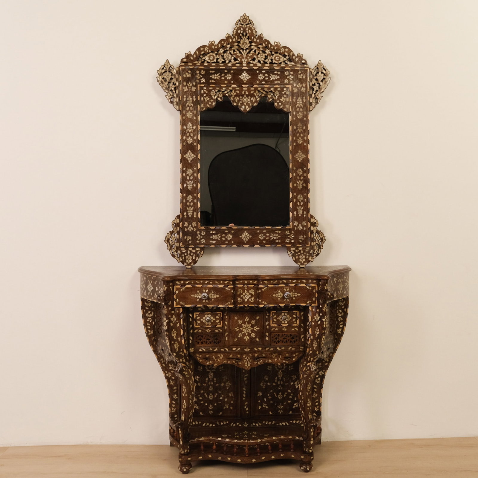 Moorish Style Inlaid Console Table & Mirror: This Moorish-style console and mirror set makes a striking, decorative focal point. The console is architectural, with a shaped apron and delicate legs covered in intricate contrasting-wood (and