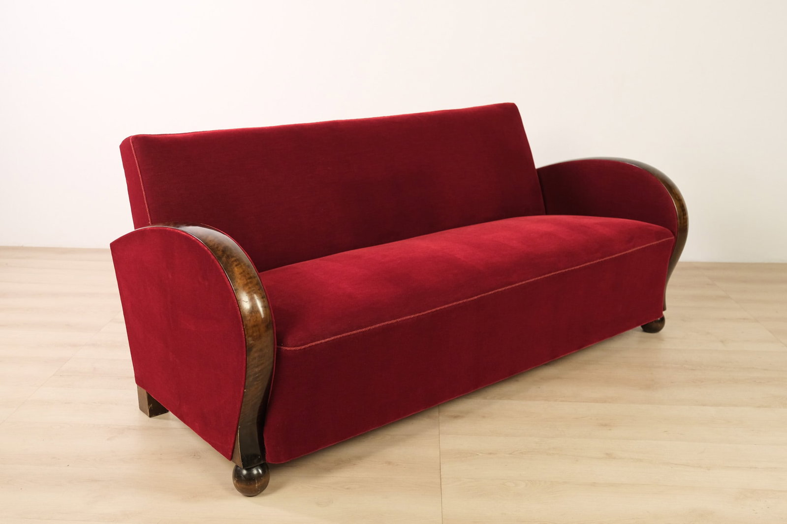 Swedish Mohair Silk Sofa, c. 1930: A Swedish Art Deco sofa with a streamlined silhouette. Upholstered in a rich wine-red mohair silk velvet, with a gently curved, loose seat cushion and a clean, tailored back. Dramatic rounded exposed 
