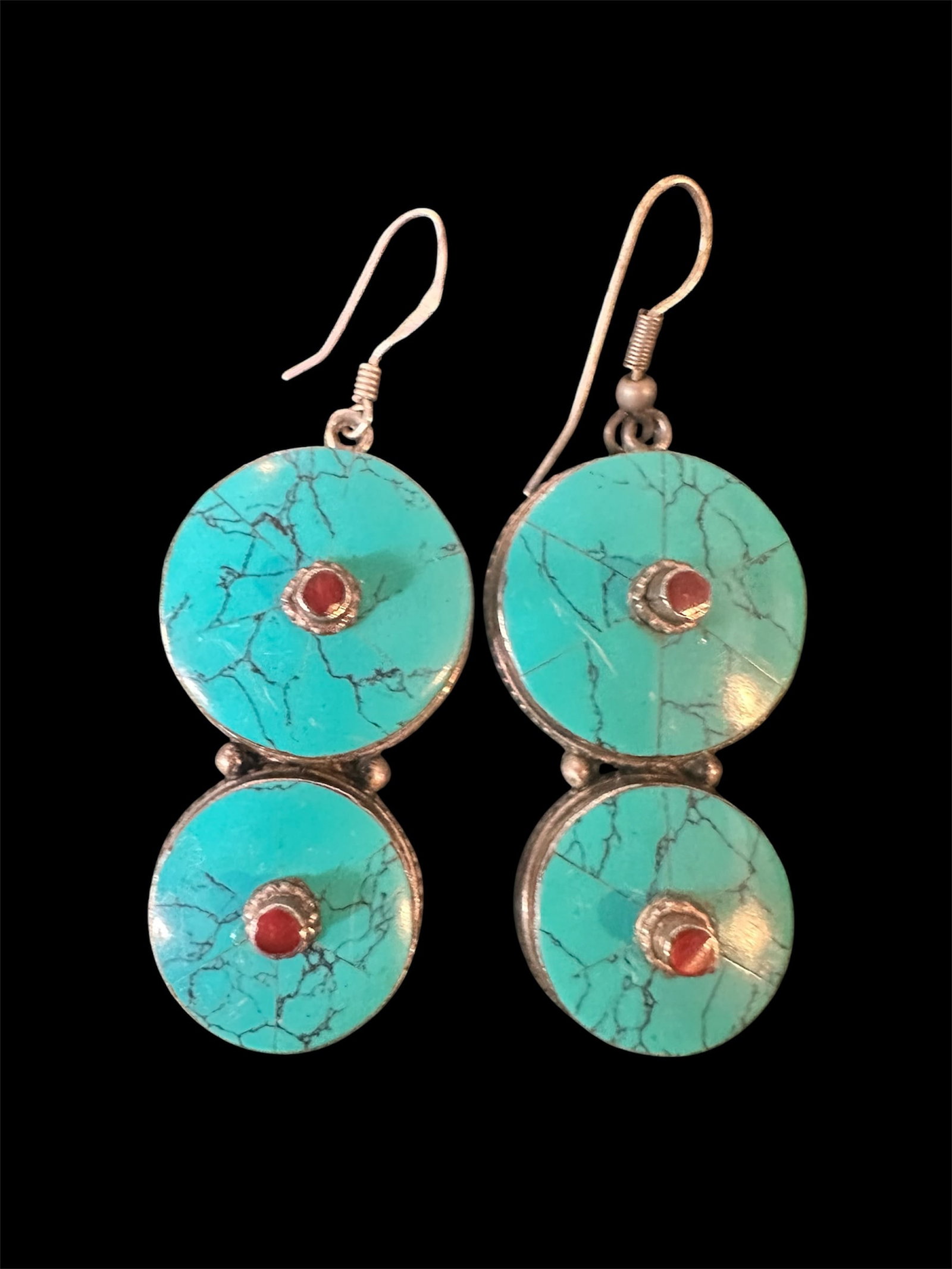 Silver and turquoise Earrings w/Coral: Dangling turquoise and coral earrings with silver findings.