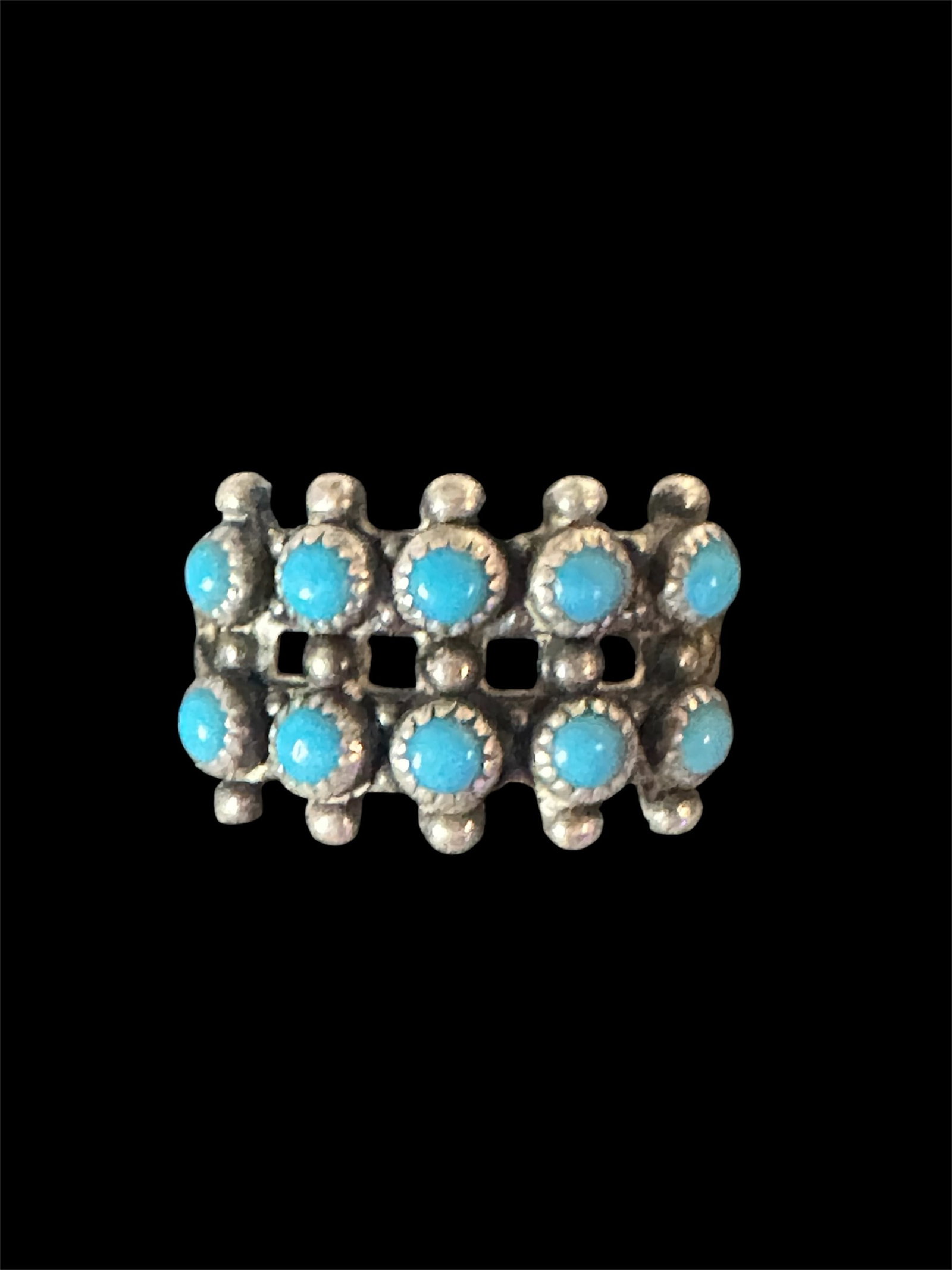 Sterling Silver w/ Turquoise stones double row: This is a Native American Bell Trading Post sterling silver ring featuring a double row of turquoise stones.