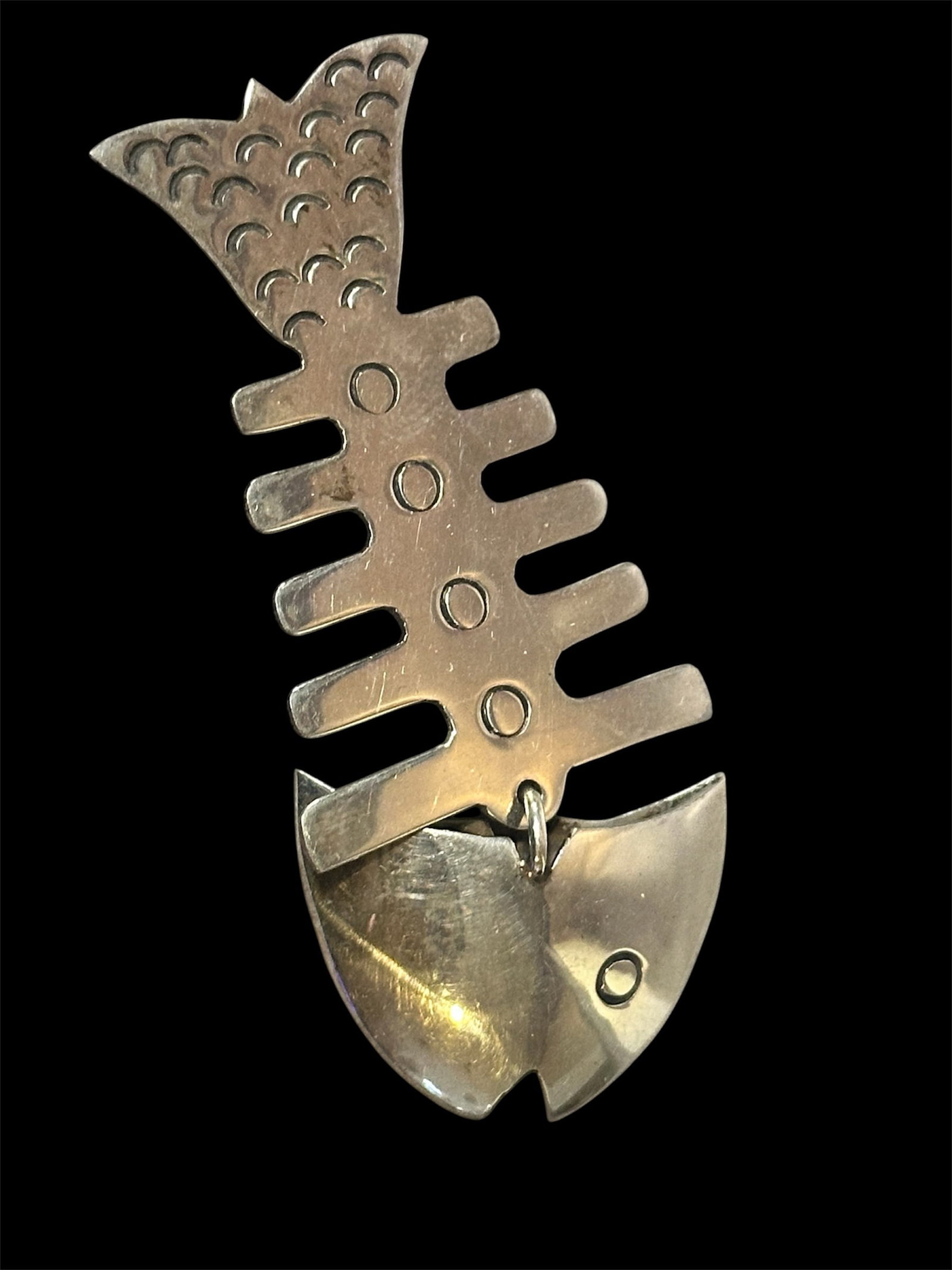 Sterling Silver Fish Brooch: A modernist sterling silver fish skeleton brooch from Taxco, Mexico.