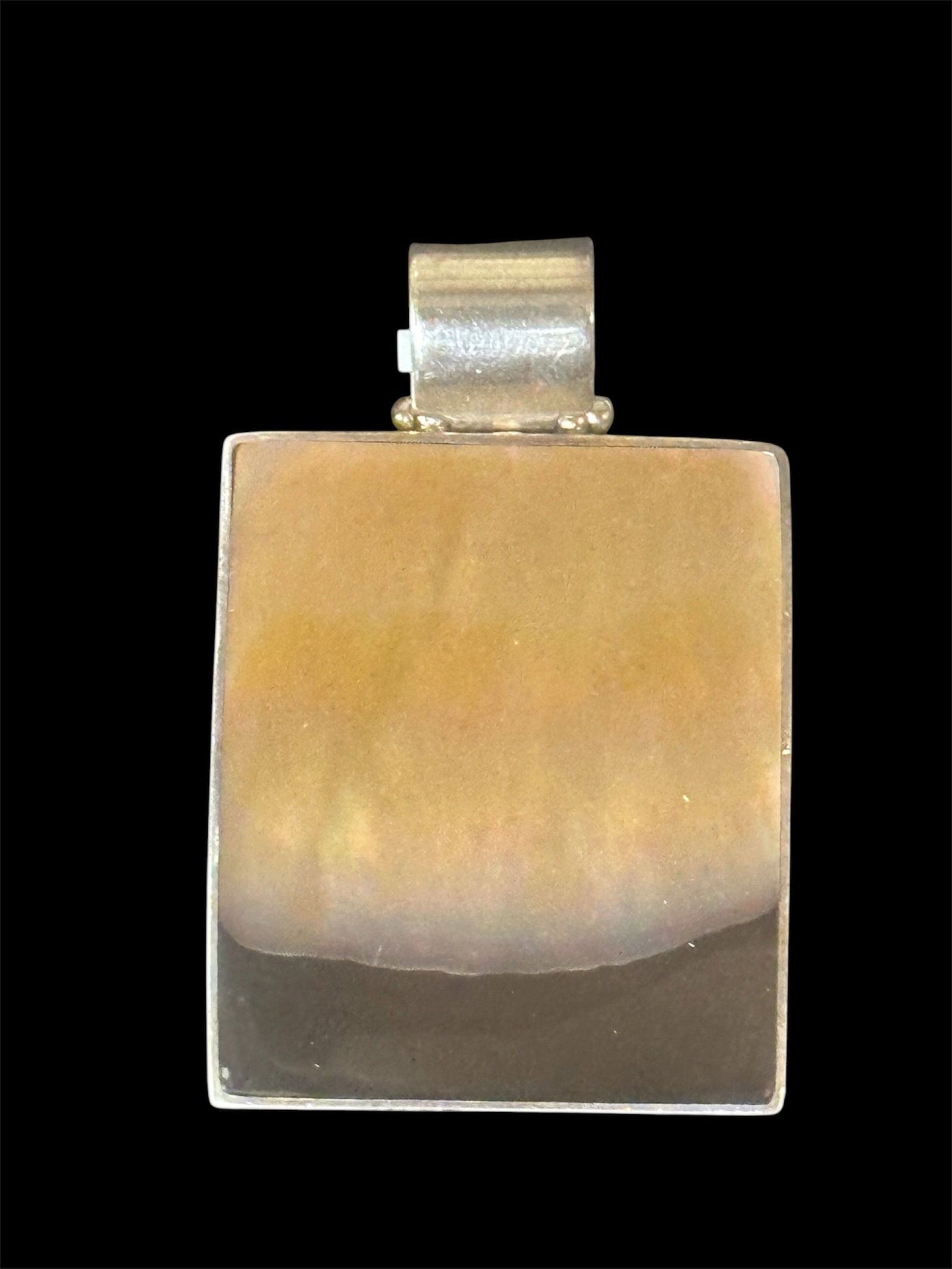 Sterling Silver Pendant: Silver pendant with mother of pearl and onyx inlay.