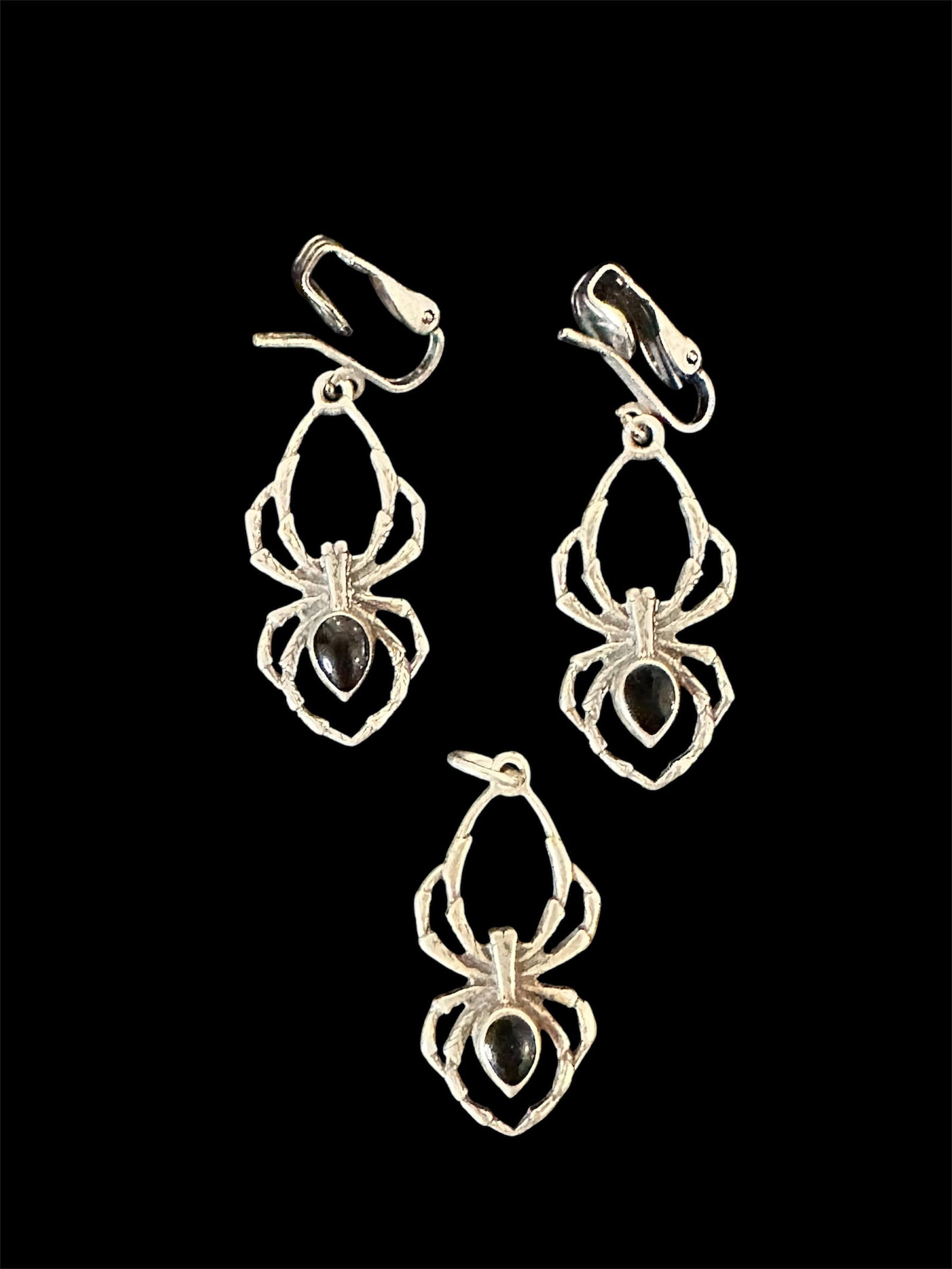 Sterling silver spider earrings and pendant: Sterling silver spider earrings and pendant with black onyx. The price is for the whole set