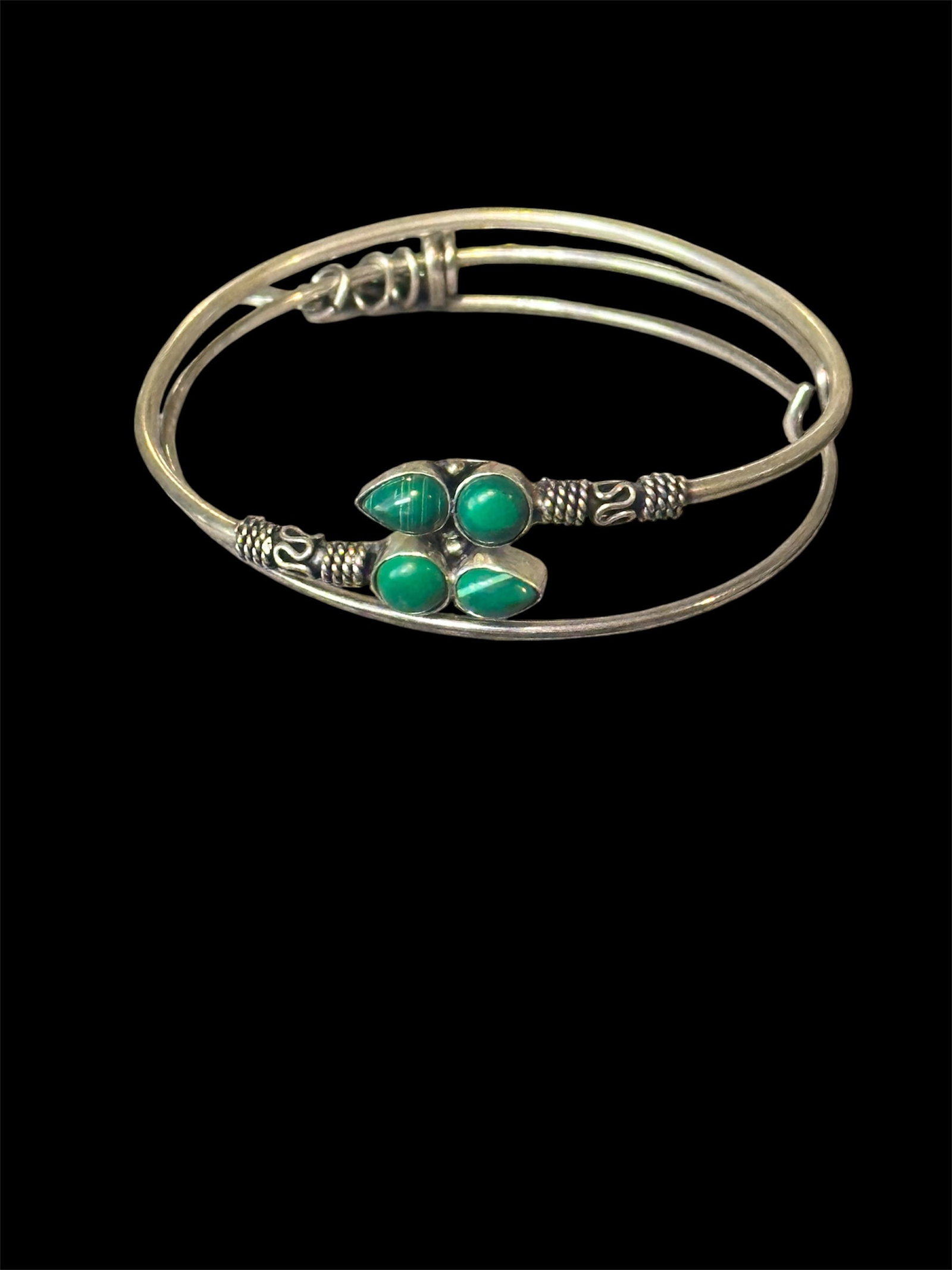 Vintage sterling silver cuff bracelet: Vintage sterling silver cuff bracelet with four malachite cabochon stones.