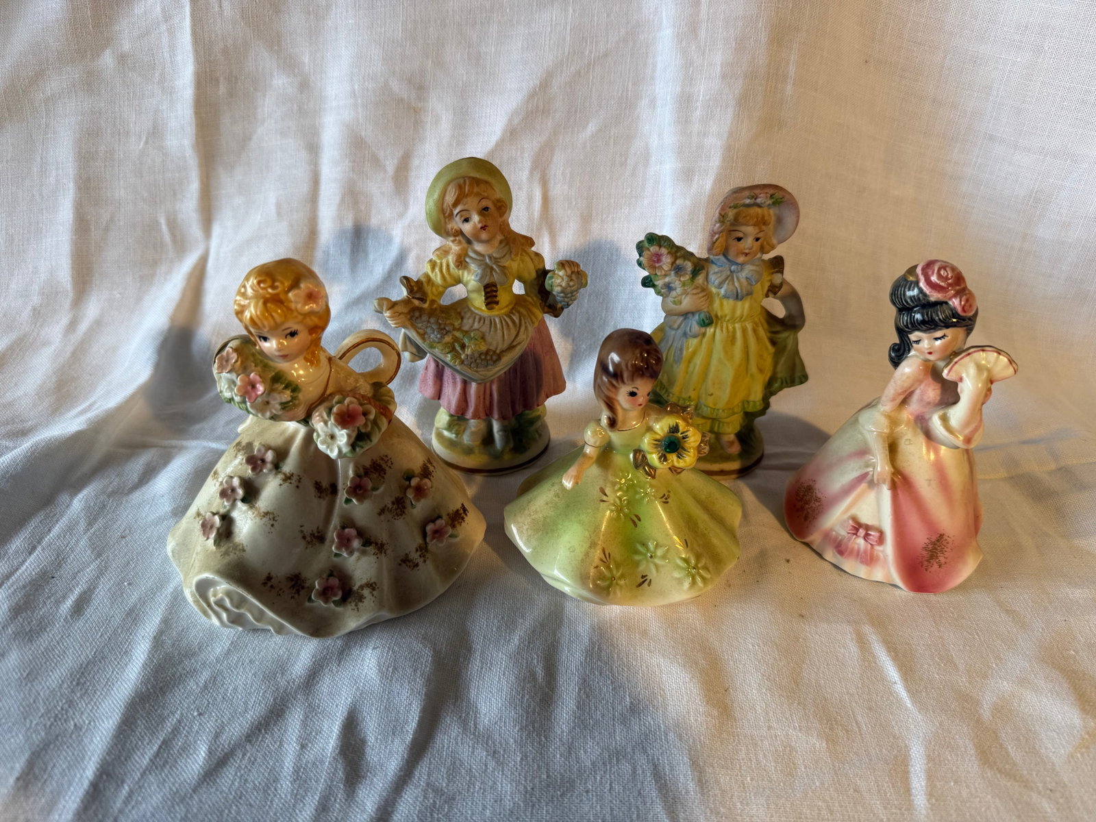 Assorted Female Figurines.: Made in Japan. 1 Lefton. 1 Josef Original, others unmarked. 5 pieces. Dimensions: Largest- 5in H x 4.5in W x 3.5in D.
