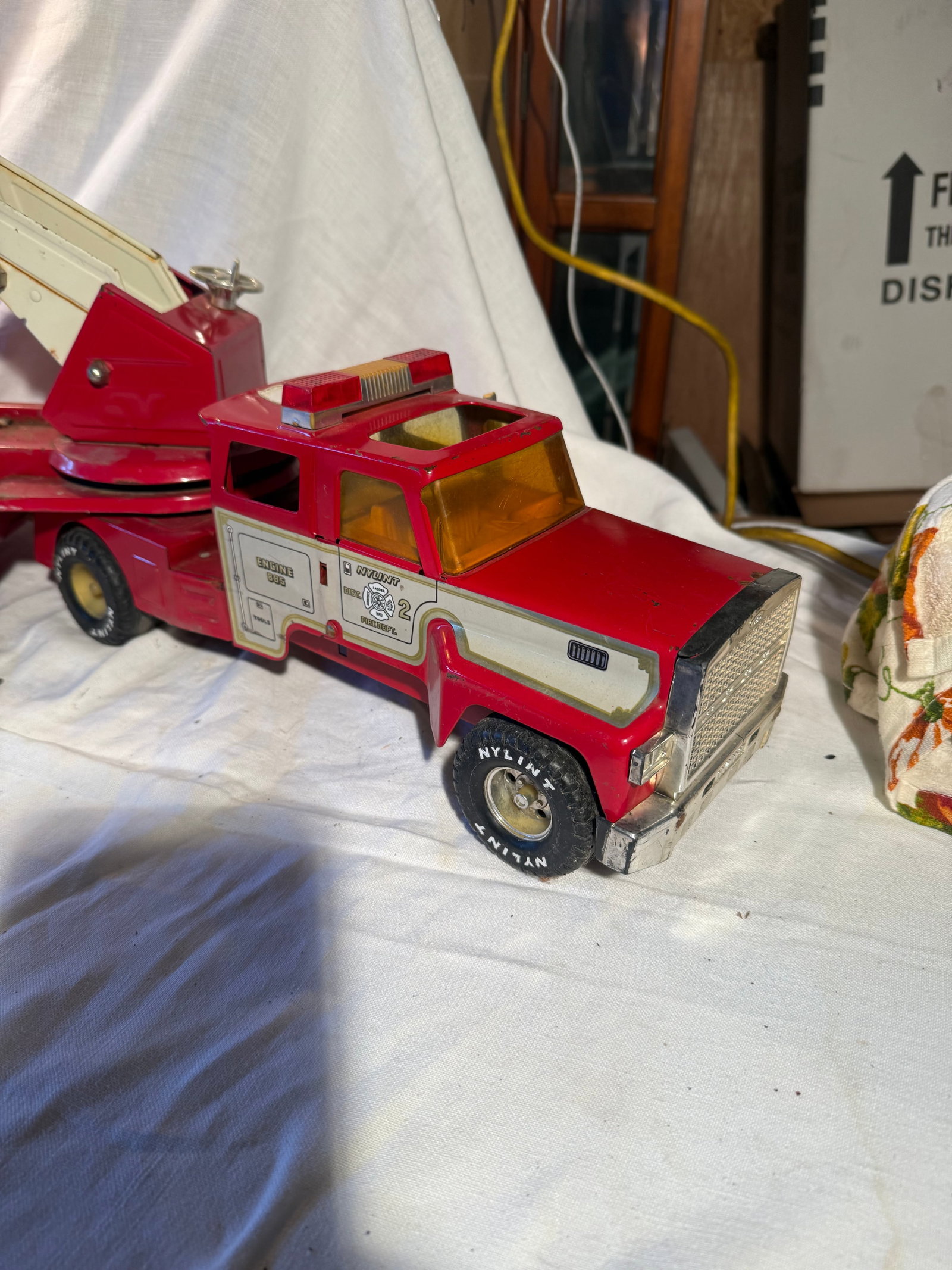 Nylint Fire Truck: Pressed steel and plastic. Ladder works, extension is broken. Typical wear