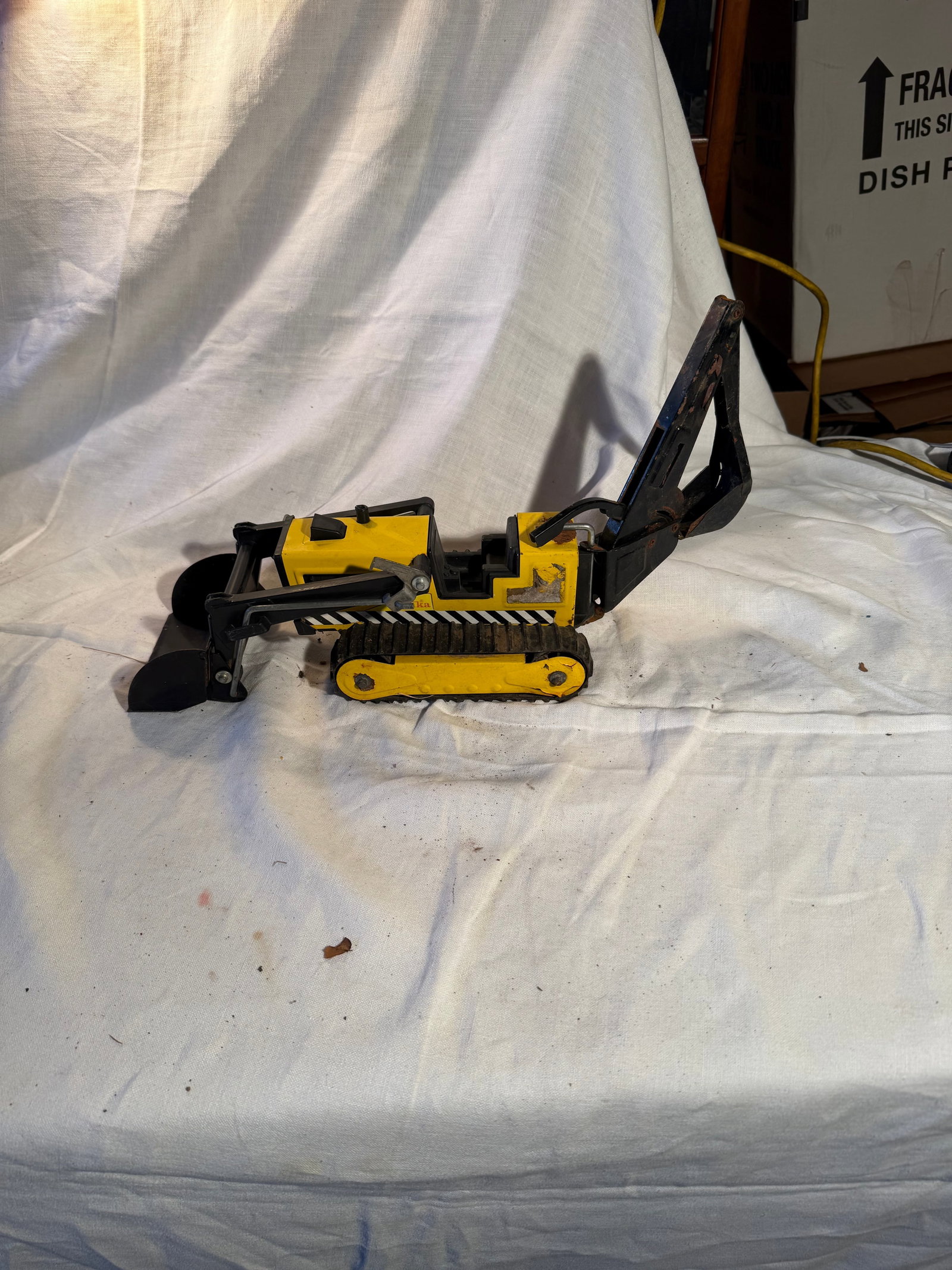 Tonka Backhoe: Pressed steel and plastic. Typical wear, some rust. Parts all move