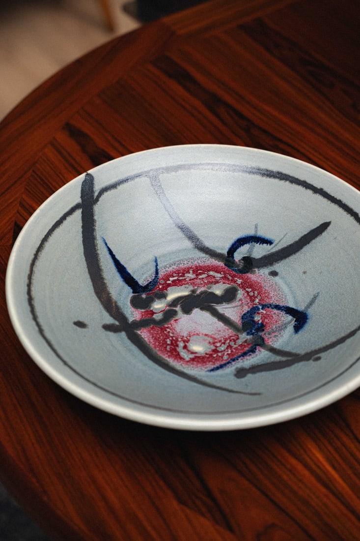 Gerald Newcomb (PNW Artist) Ceramic Plate 15", 1970s: Wheel-thrown studio pottery charger/large plate by Washington-based potter, Gerald Newcomb. This piece features a raised wheat sheaf design. Hand signed 'Newcomb' to the underside.