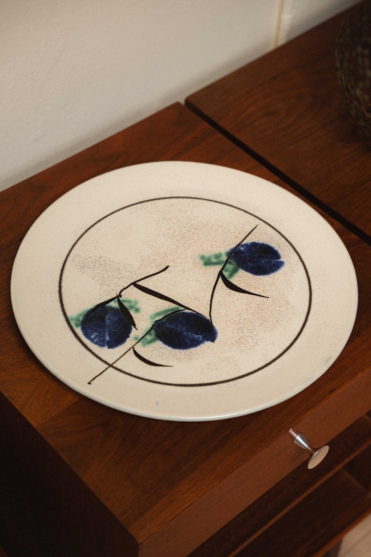 Gerald Newcomb (PNW Artist) Ceramic Plate 15", 1970s: Wheel-thrown studio pottery charger/large plate by Washington-based potter, Gerald Newcomb. This piece features a raised wheat sheaf design. Hand signed 'Newcomb' to the underside.