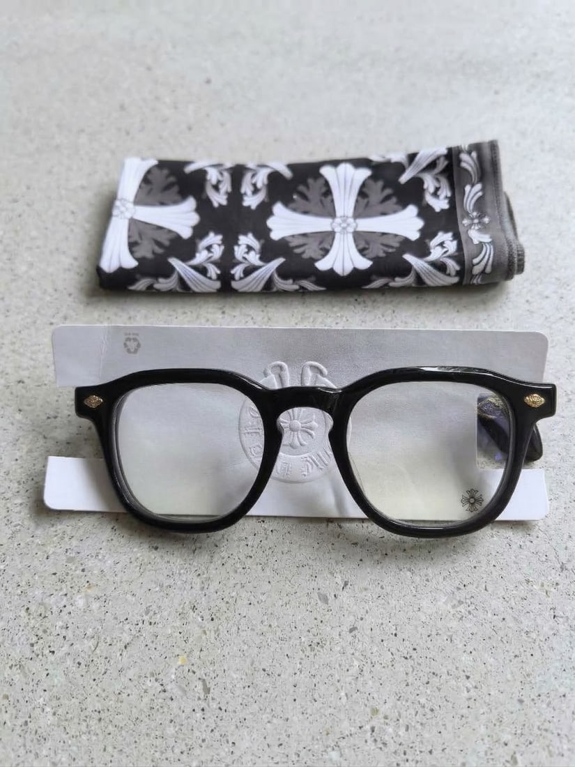 Chrome Hearts Chirp Chirp Glasses with Lens Cleaning Handkerchief, Black and Gold. Made in Japan: Chrome Hearts 'Chirp Chirp' glasses. Made in Japan engraved on the inside of the temple. A distinctive piece for Chrome Hearts collectors and eyewear enthusiasts. Frame size for is written in