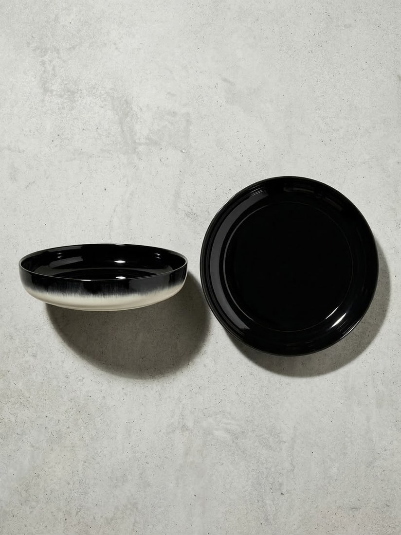ANN DEMEULEMEESTER X SERAX Porcelain Bowl (Set of 2) Belgian: Large deep plate. WHITE/BLACK VAR B DE? Glazed Porcelain L 24 x W 24 x H 4.2 cm Ann Demeulemeester, iconic Belgian fashion designer and member of the avant-garde Antwerp Six. Renowned for poetic, mini