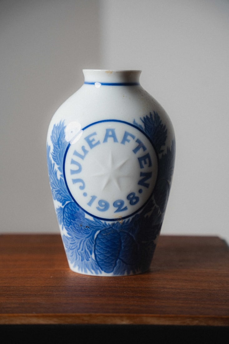 Royal Copenhagen Bing & Grondahl Porcelain Christmas Vase, 1928: Presenting a Royal Copenhagen / Bing & Grøndahl porcelain Christmas vase dating to 1928, part of a cherished annual series that has captivated collectors since its inception in the late 19th century.