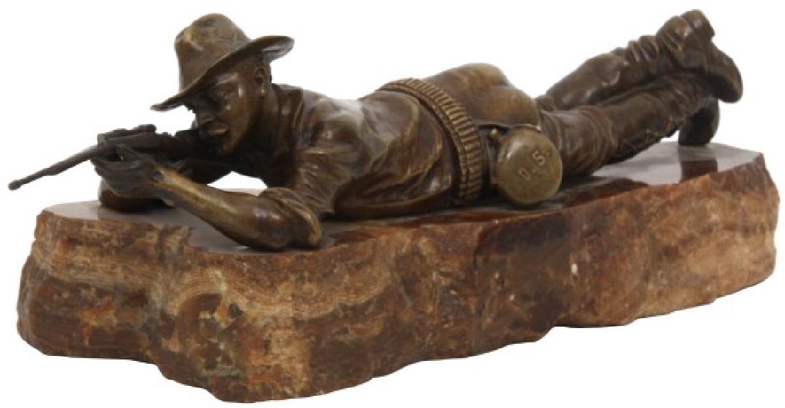 Carl Kauba Bronze Sculpture – Marksman: Carl Kauba (1865-1922, Austrian) bronze figure of a U.S. ranger or scout laying in prone position and aiming down his carbine rifle, has a U.S. marked canteen and crossed rifle marksman pin on his hat