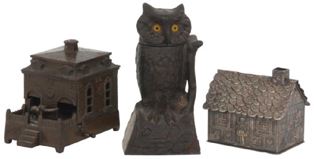 3 Cast Iron Toy Banks: 3 Cast Iron Toy Banks With Mechanical Banks. 1) J. & E. Stevens owl mechanical cast iron bank c.1880 with glass eyes and swivel head, working and has trap door; 7.5 in. high x 3.75 in. wide x 3 in. de