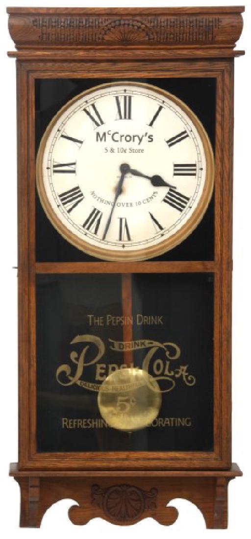 McCrory's Store Dual Advertising Wall Clock: McCrory's Store Dual Advertising Wall Clock. 12 in. paper dial reads “McCrory's 5 & 10 C. Store - Reading, PA – Nothing Over 10 Cents”, has black Roman hour numerals and large hands; pierced bra
