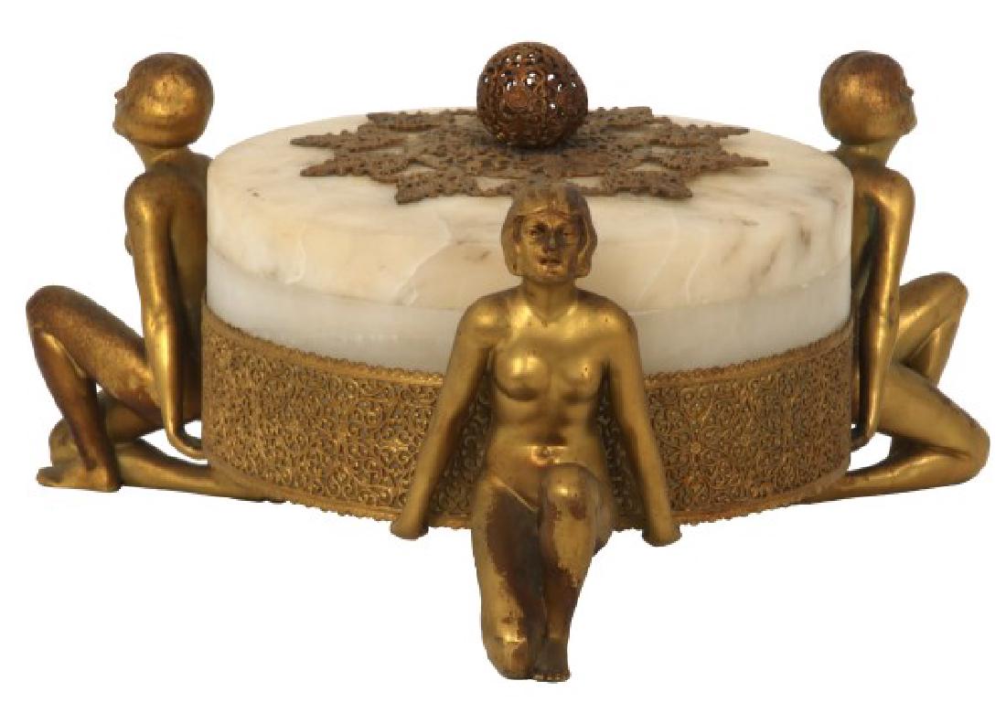 Alabaster Covered Box With Gilt Figures: Alabaster Covered Box With Gilt Figures. Turned white alabaster bowl and cover has nice translucence, mounted with a pierced decorated brass ball finial and mount on the lid and collar around the bott