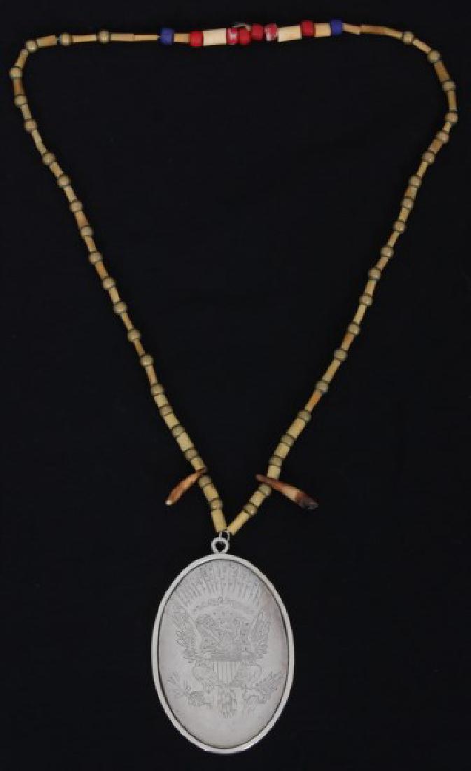 Lg. Coin Silver Indian Peace Medal: Lg. Coin Silver Indian Peace Medal. Oval pendant with engraved scene of a Native American Indian dropping his battle axe and handing a peace pipe to George Washington, reads "George Washington, Presid