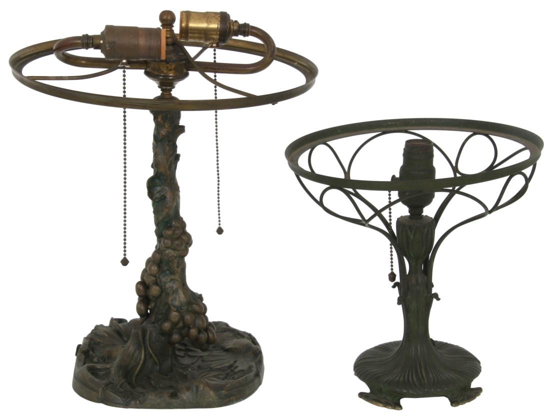2 Pairpoint Mfg. Co. Lamp Bases: 2 Pairpoint Mfg. Co. Lamp Bases. 1) Grape pattern lamp base, cast spelter, 2 replaced sockets, 12 in. dia. shade ring. No breaks or damage, unsigned. 13.5 in. high to shade ring. 2) Lotus flower base,