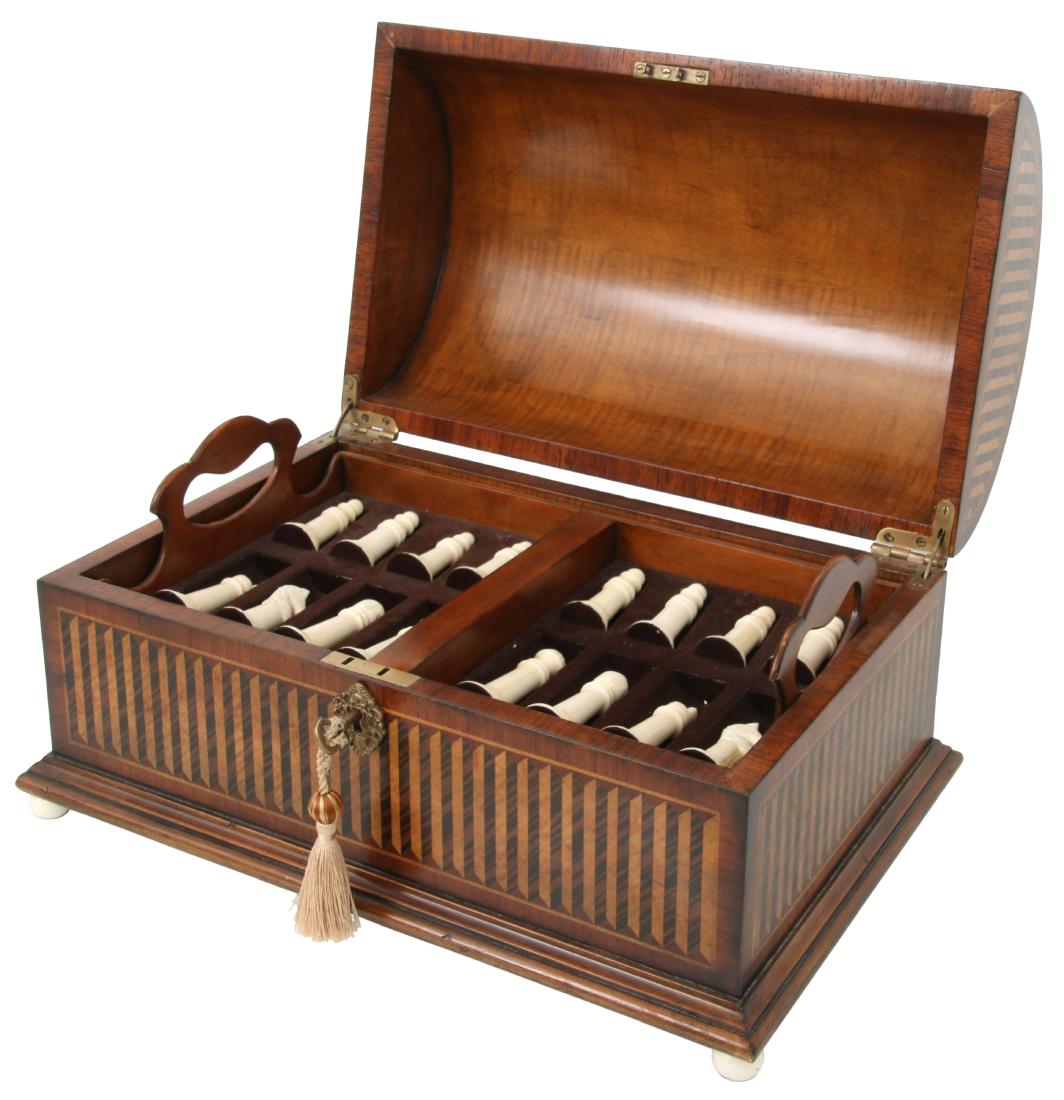 Carved Chess Set In Inlaid Box: Carved Chess Set In Inlaid Box. Excellent mahogany dome top hinged box with beautiful inlaid panels, brass escutcheon, turned bone feet; the interior has 2 removable trays with felt lined divided spac