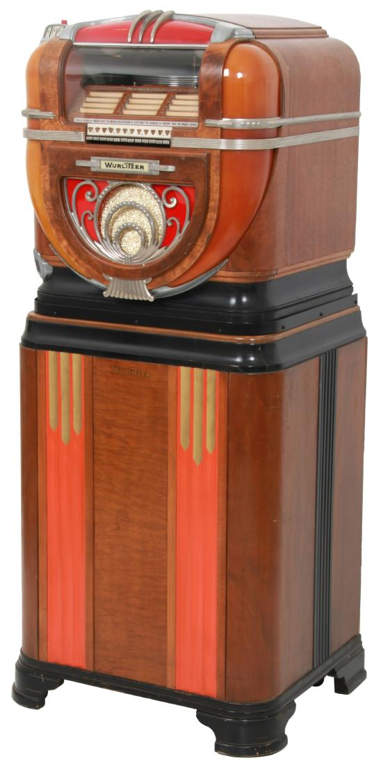 Wurlitzer Table Model 71 Jukebox: Wurlitzer Table Model 71 Jukebox On Stand - 1940. Wood veneered case with amber and red plastics, metal trim pieces and speaker grill; keyboard style selector with 12 tunes, accepts nickels, dimes & q