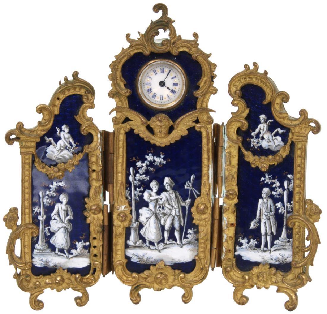Bronze & Enamel 3 Panel Screen Cabinet Clock: Miniature Bronze & Enamel 3 Panel Dressing Screen Cabinet Clock. Gilt bronze frame with rococo filigree, draped garland and figural winged putti head; has 3 cobalt enamel panels with white and black l