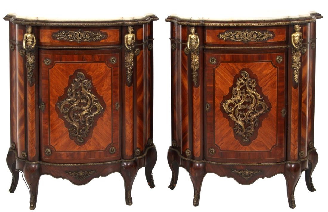 Pr. Bronze Mounted Rosewood Marble Top Credenzas: Pr. Bronze Mounted Rosewood Marble Top Credenzas. Serpentine form with shaped white marble top, has bronze mounted trim, figural corner corbels and pierced decorated bronze panel on the door; beautifu