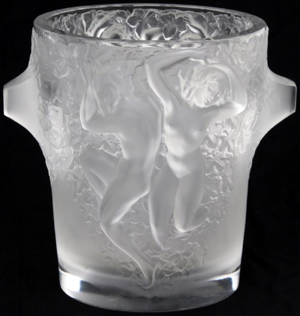 Lalique France "Ganymede" Pattern Ice Bucket: Lalique France "Ganymede" Pattern Ice Bucket. 9 in. high ice bucket (champagne cooler) in Lalique's "Ganymede" pattern with a pair of dancing Baccante figures surrounded by grape leaves on the front a