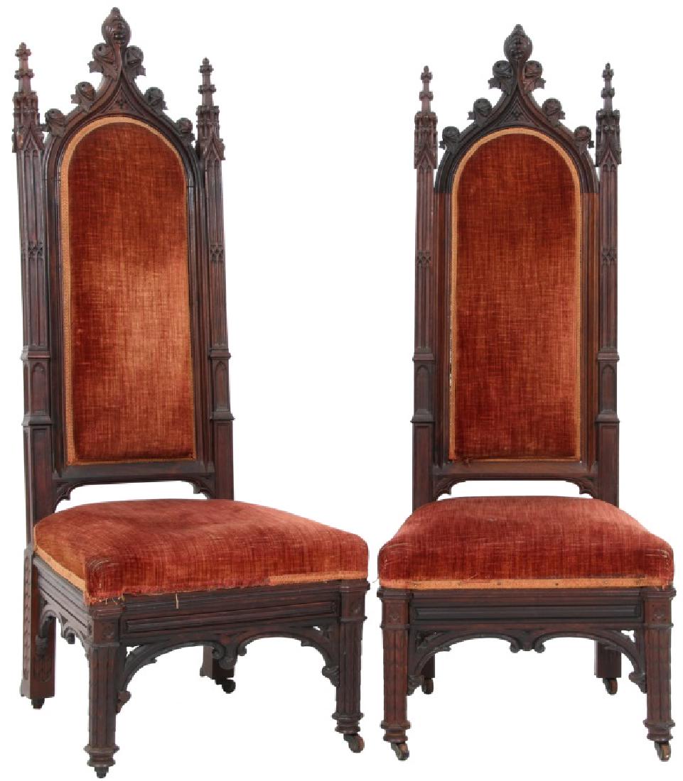 Pair of Gothic Carved Rosewood Sidechairs: Pair of Gothic Carved Rosewood Sidechairs. Gothic arch shaped backs with filigree carved crests, squared spire carved side posts, fancy carved legs and pierced carved stretchers. Clean enhanced origin