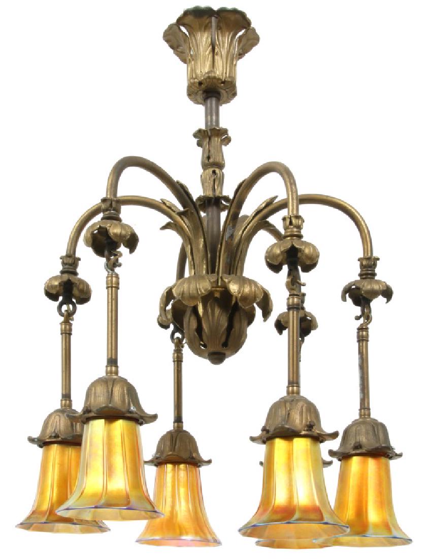 Bronze 6 Light Chandelier with Quezal Shades: Bronze 6 Light Chandelier with Quezal Shades. Bronze fixture has applied filigree sections in the stem and lower center cluster with 6 arms arching downward with leafy mounts and pendant sockets with