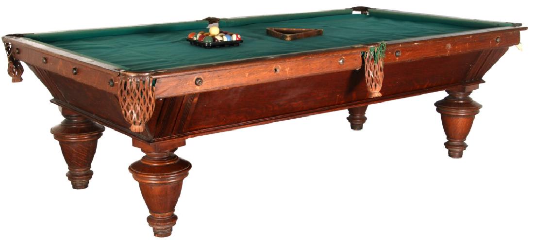 Oak Antique 9 ft. Pool Table: Antique Oak 9 ft. Pool Table. Has oak rails with leather pockets, 3 slats, splayed aprons and large turned legs; Missing 4 side bank bolts and 6 bolt caps, missing 1 pocket frame, crack in one slate;