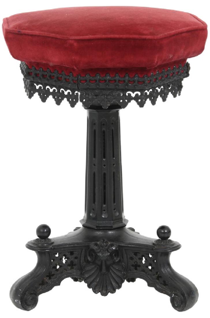 Gothic Pierced Cast Iron Organ Stool: Gothic Pierced Cast Iron Organ Stool. Octagonal swivel seat with adjustable height, pierced filigree decorated apron, has a pierced decorated octagonal stem, and stands on 3 scrolling feet with pierce