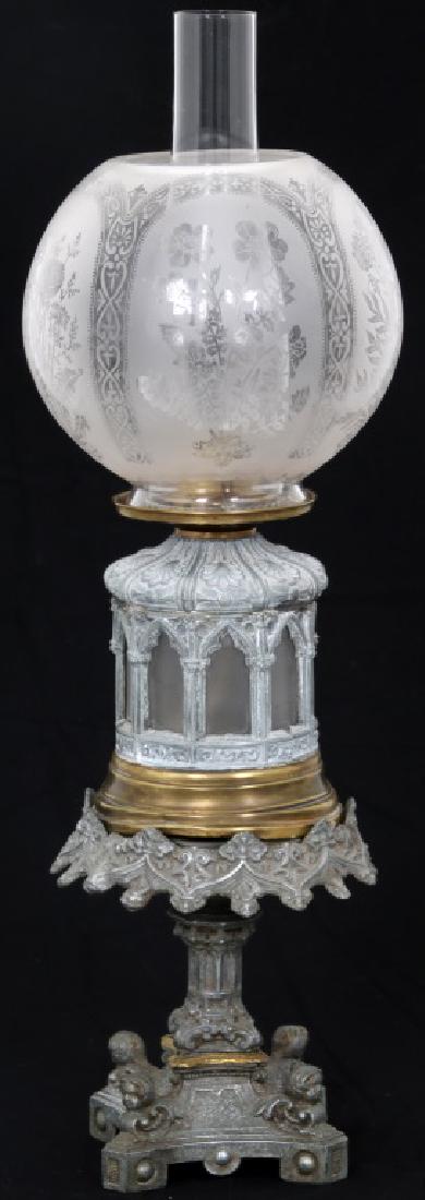 Gothic Oil Font Lamp on Stand: Gothic Oil Font Lamp on Stand. Excellent pierced decorated cast spelter lamp base decorated with seashells, filigree and gothic arches, glass oil font insert, brass bottom and a "Queen Anne No. 2" bur