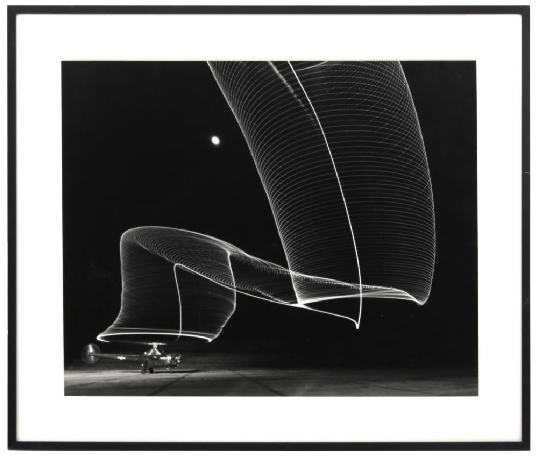 Andreas Feininger Helicopter Photograph: Andreas Feininger (American, 1906-1999) gelatin silver print, nighttime long exposure photograph of rotating helicopter blades at takeoff. Ink stamp on the reverse "Image is limited to fifty plus ten