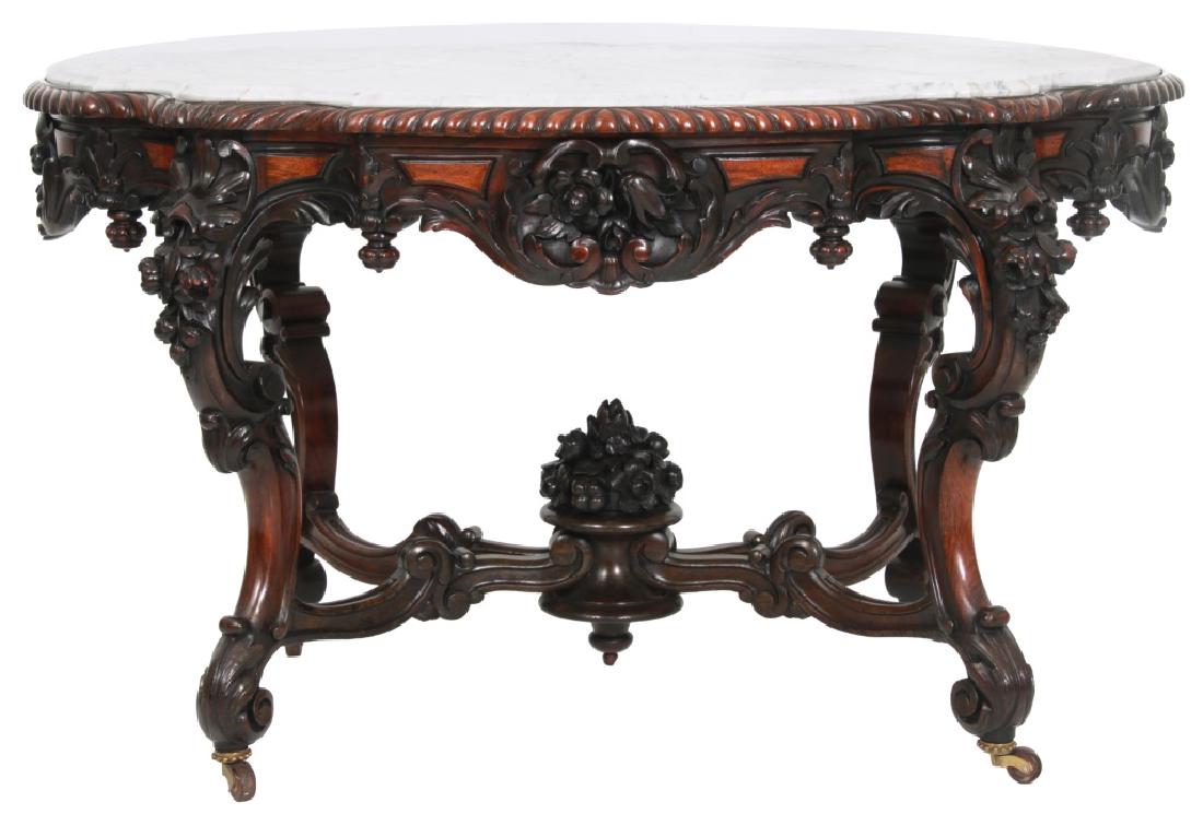 Rosewood Turtle Top Marble Top Table Attr. A. Roux: American Rococo Carved Rosewood Turtle Top Marble Top Parlor Table, Attr. A. Roux. Inset turtle shaped white marble top with gadroon carved edge, raised panels on the apron with heavy swirling filigre