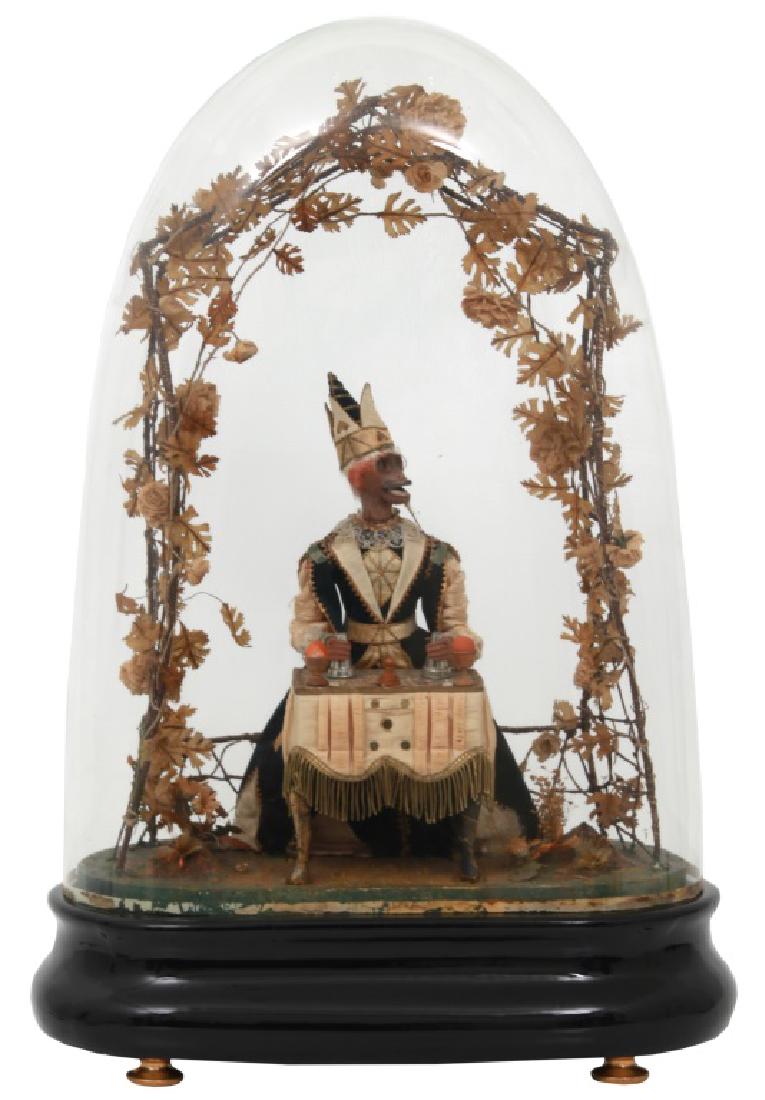 Phalibois Musical Automaton "The Monkey Conjuror": Jean Phalibois Musical Automaton "The Monkey Conjuror". Wood an paper mache automaton with seated figure of a monkey magician wearing silk and velvet gypsy garments and seated at a table with table cl