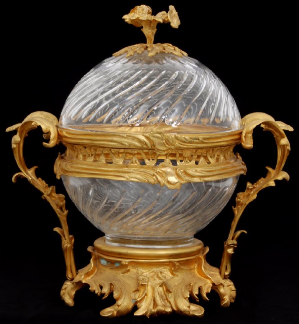 Louis XV Style Gilt Bronze & Cut Glass Centerpiece: Louis XV Style Gilt Bronze & Cut Glass Centerpiece. Large gilt bronze pierced filigree decorated frame with flowers and seashells at the side handles, filigree decorated feet and a large floral bronze