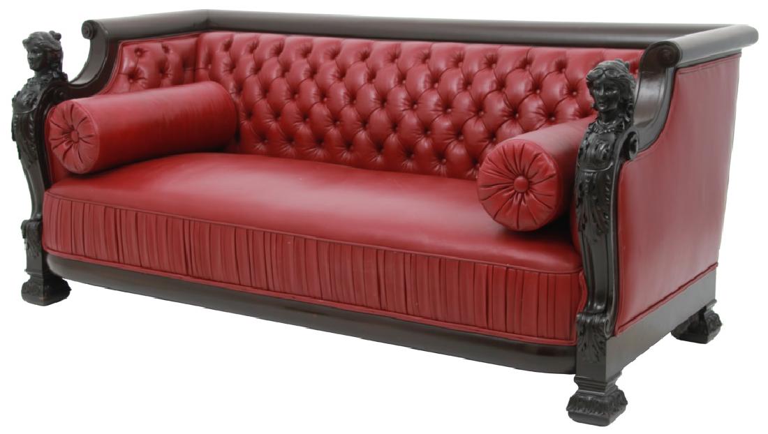 Attr. R.J. Horner Carved Mahogany Maiden Sofa: Attr. R.J. Horner Carved Mahogany Maiden Head Sofa. Even arm sofa has a rolled back and arms with large figural carved maiden's heads over S-scrolls at the front and stands on large block form feet wi
