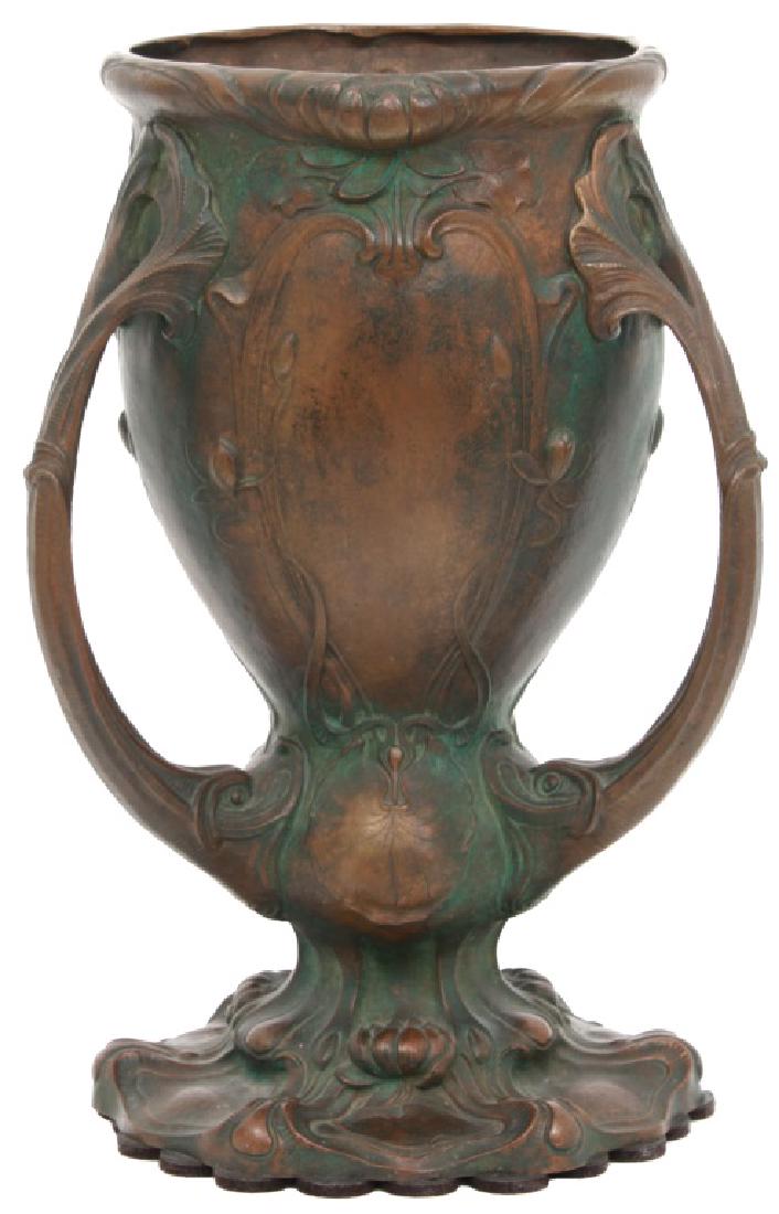 Gorham Co. Bronze Loving Cup: Gorham Co. Bronze Loving Cup. Beautiful cast bronze 3 handled trophy form cup with relief pond lily pads and flowers and has figural dolphin handles; signed on the bottom "Gorham Co., G33", monogramme
