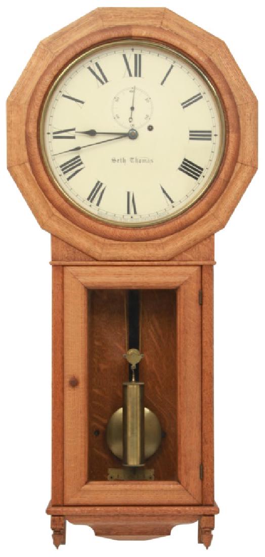 Oak Seth Thomas No. 3 Regulator: Oak Seth Thomas No. 3 Regulator. 12" painted metal dial with black Roman hour numerals, sub seconds and blued spade hands; brass 8 day weight driven time only movement signed with Seth Thomas trade ma